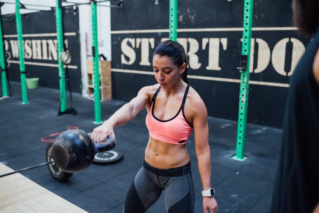 Young woman working out while using Anadrol: A powerful anabolic steroid sold by https://legacypharma.is/